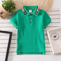 Classic boys' polo shirt in solid colors, perfect for casual and semi-formal occasions.