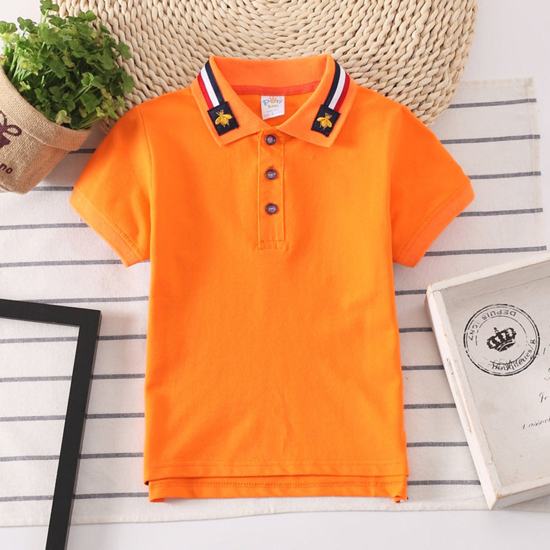 Versatile solid color polo shirt for boys, suitable for various occasions and everyday wear.