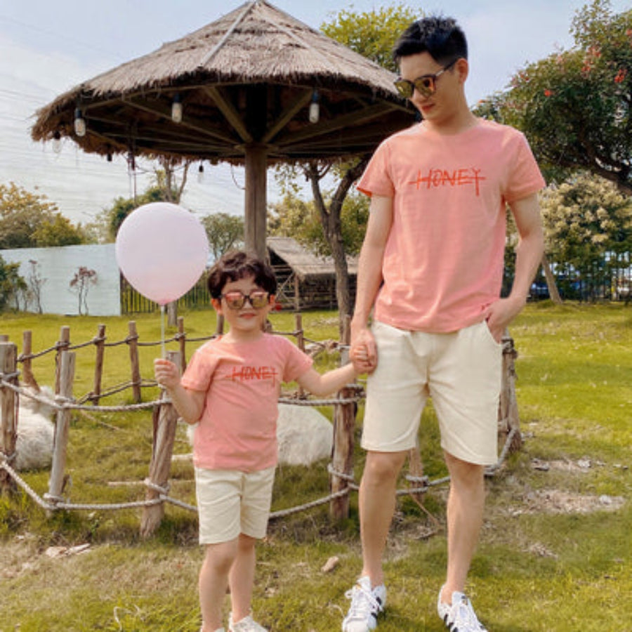 Father and son enjoying a casual summer outing in matching outfits