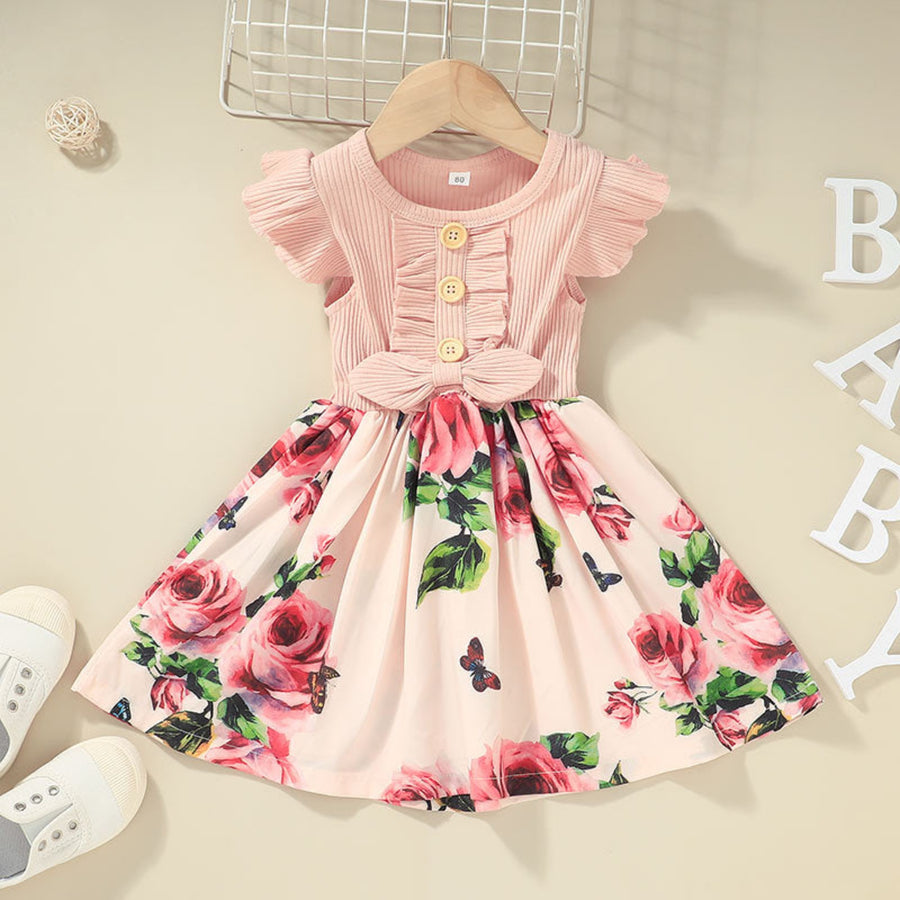 Stylish toddler girls dress paired with matching accessories.