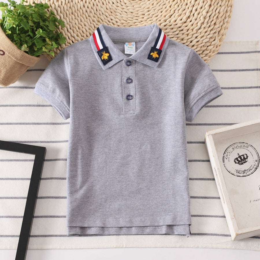 High-quality cotton blend polo shirt for boys, offering comfort and durability.