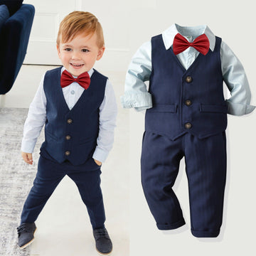 Boy wearing a shirt and trousers dress suit with a matching vest.