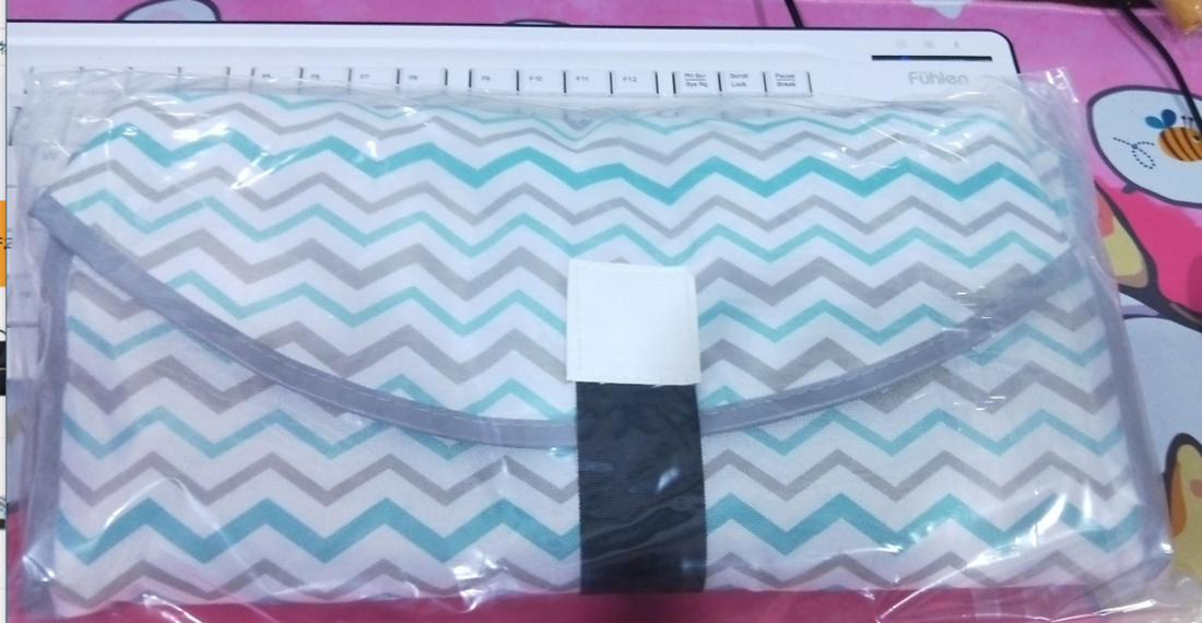 Blue diaper changing pad for newborns