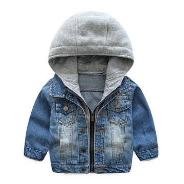 Boy wearing a stylish washed soft denim jacket with button closures.