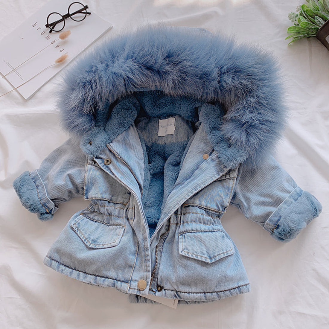 A girl in a fashionable denim jacket, ideal for casual wear.