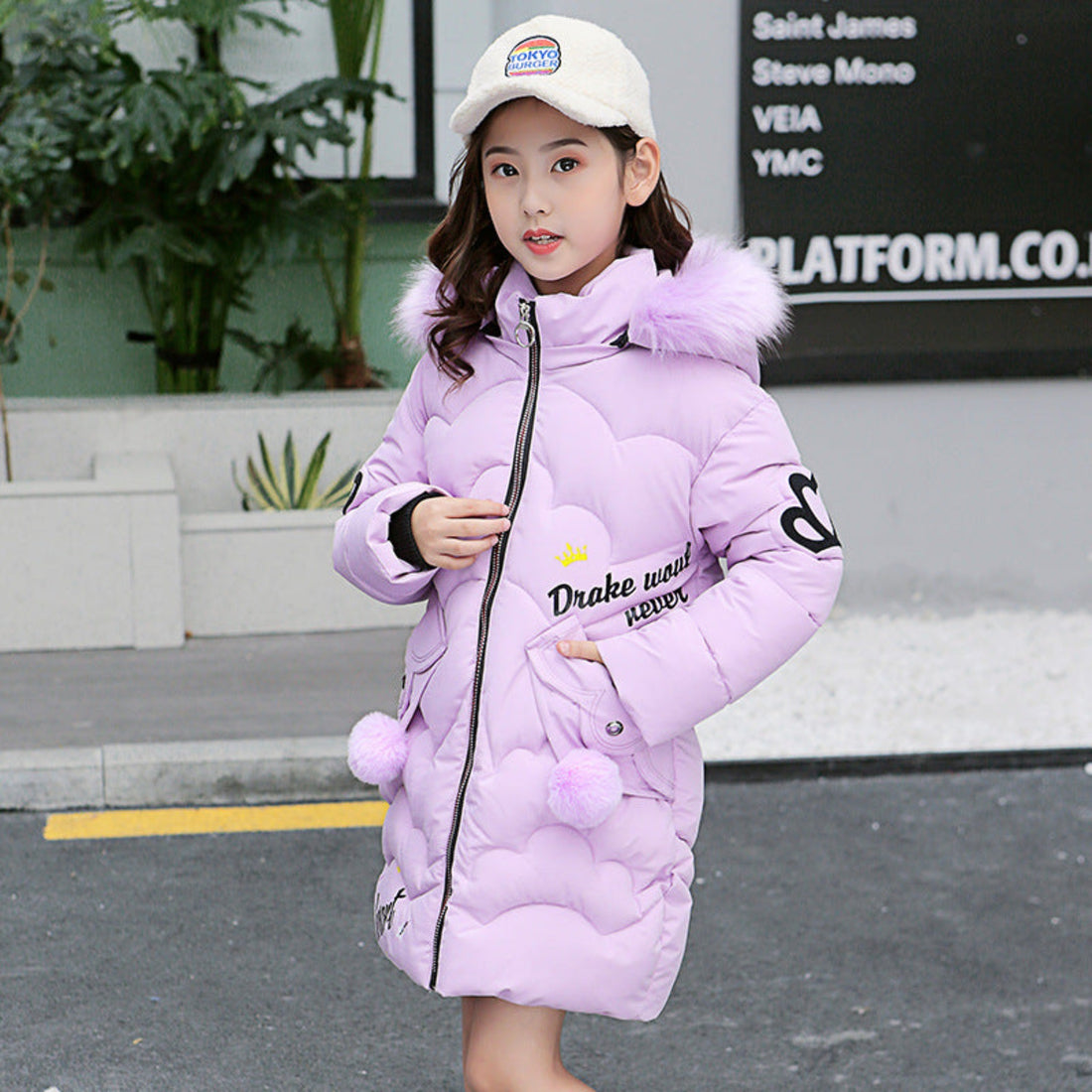 Stylish cotton-padded jacket for girls, ideal for winter outings.