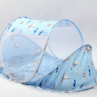 Blue foldable baby bed with net and pillow