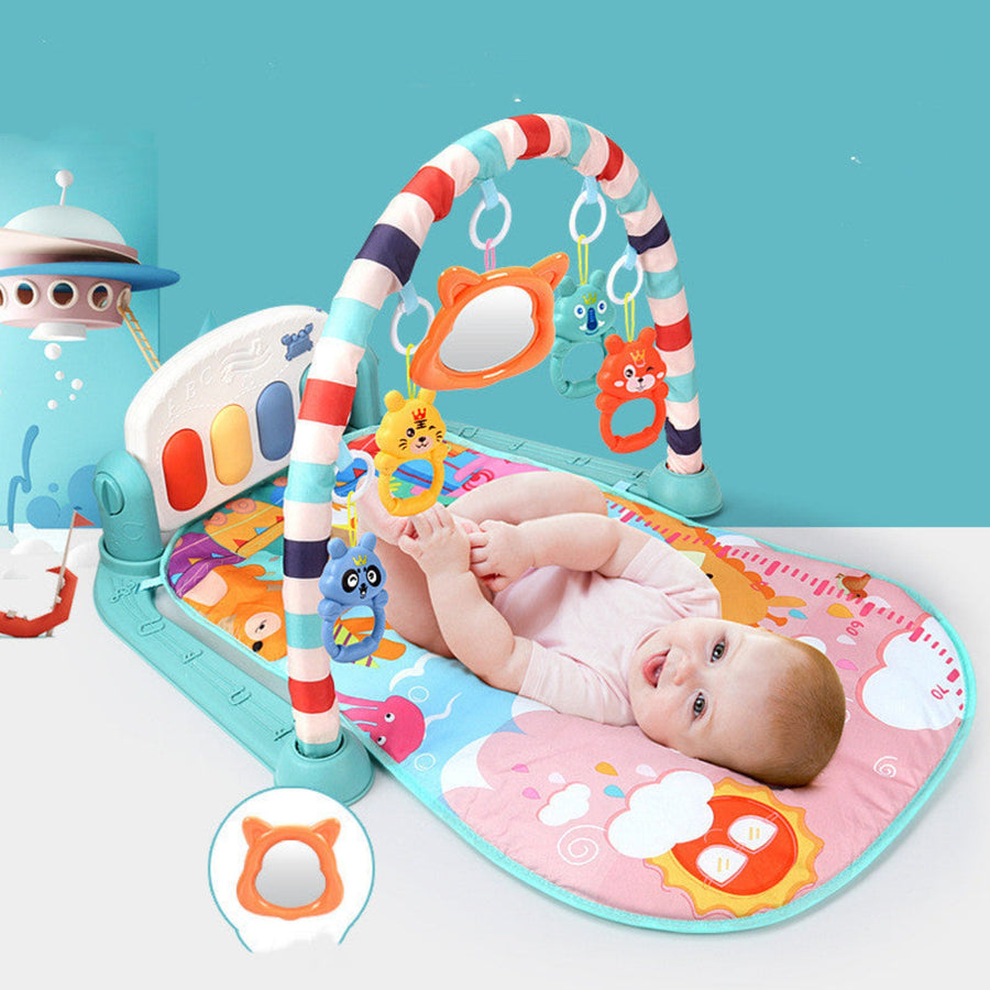 Baby engaging with piano toys on fitness rack