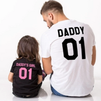 Family dressed in pink outfits with word print designs