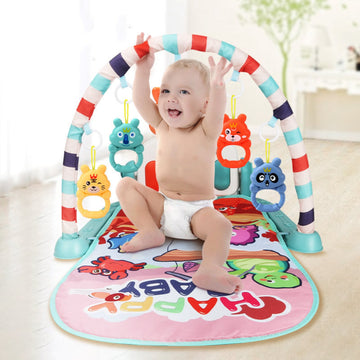 Baby playing with fitness rack and piano toys