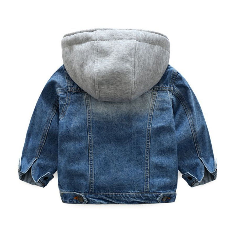 Close-up of a soft denim jacket for children featuring chest pockets.